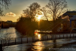 sunset over flooded medway and lockmeadow footbridge