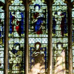 lady chapel stained glass window showing mary and baby jesus and saints