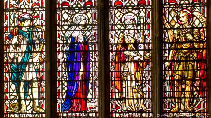 stained glass of two men and two women