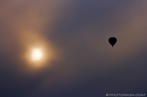 hot air balloon silhouette and sun