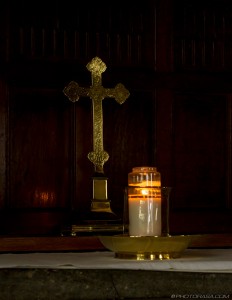 golden cross and candle