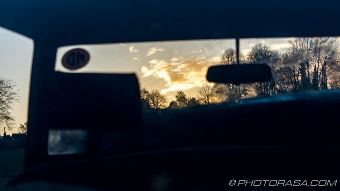 landscape through car front window