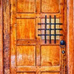 old wooden door with viewing panel