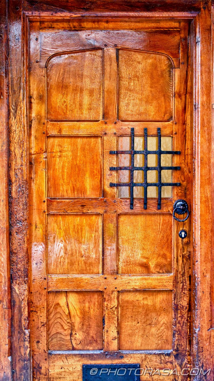 old wooden door with viewing panel