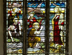 north stained glass window detail showing fishermen begging jesus for help