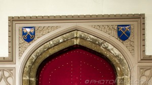 spandrel above the door to the vicars vestry showing crossed keys and crossed swords symbols