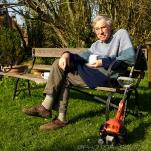 church neighbour with a cuppa and a strimmer