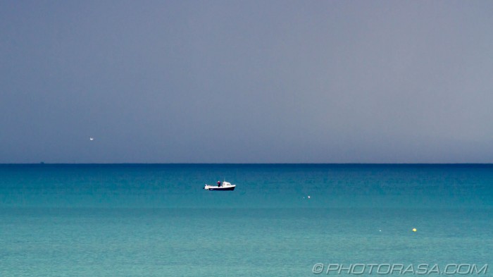 boat and stormy blue sea