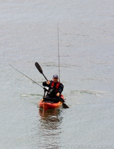 fisherman in canoe