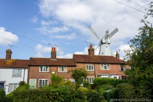 windmill behind a row of houses