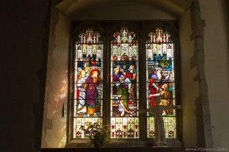 stained glass and religious statue